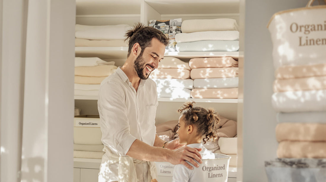 Family organizing fresh linens in a bright, tidy closet space